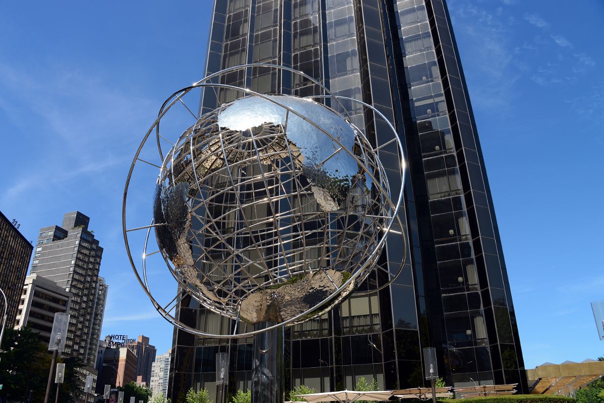 22 Steel Globe With Trump International Hotel Behind In New York Columbus Circle